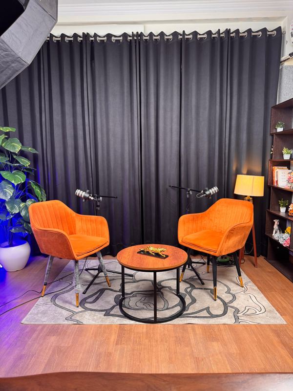 Two-chair podcast interview setup with RØDE PodMic on boom arms at Spettro Studios, Rajouri Garden, New Delhi